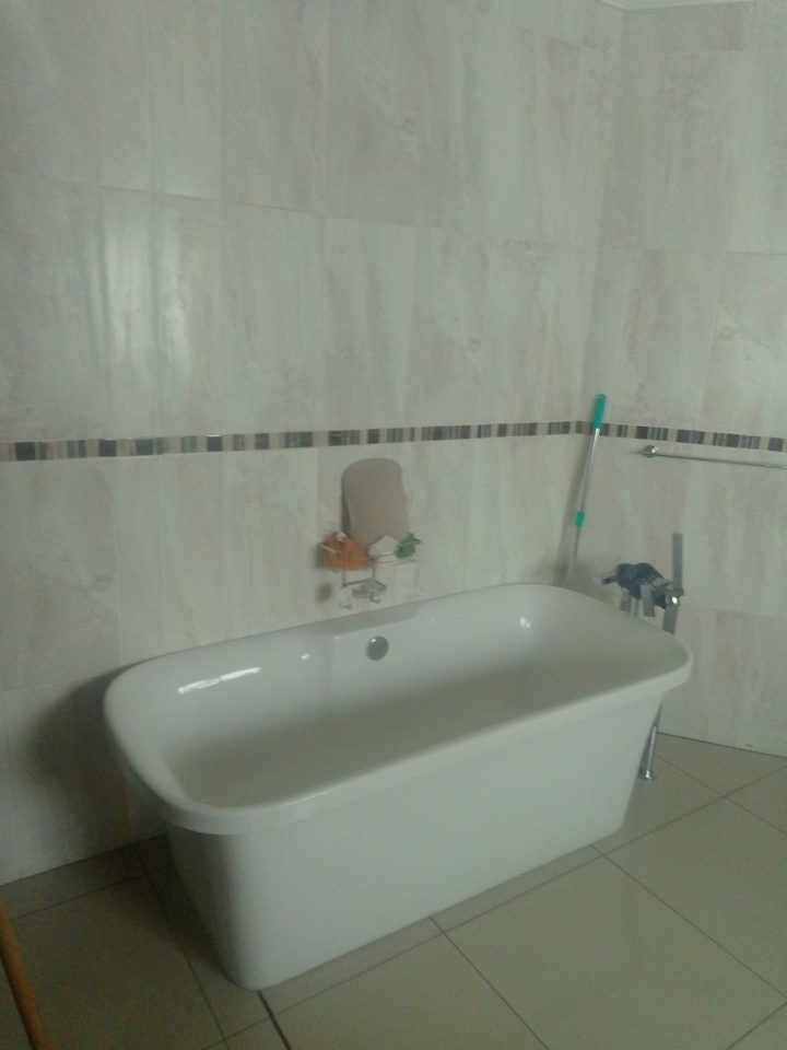 Newly plumbed freestanding bath in a finished bathroom